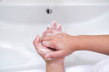 Fototapeta premium the child washes his hands.