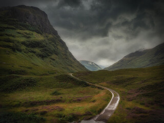 Winding road in the middle of scottish highlands