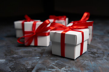 White gift box with red ribbon bow. White box with red ribbon. Gift for Christmas, New Year,...