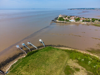 Aerial view, typical landscape fishing cabin on a sea pier with a net at Talmon in the Gironde...