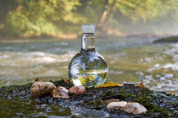 Flask with clear river water.