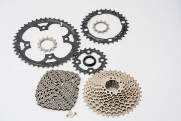 Gears, sprockets and chain of a mountain sports bike on a white background. Bicycle parts