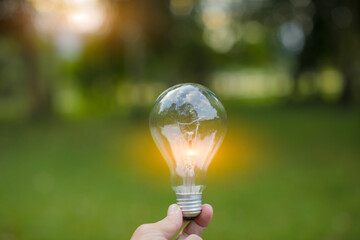 Light bulb Energy saving green nature background...