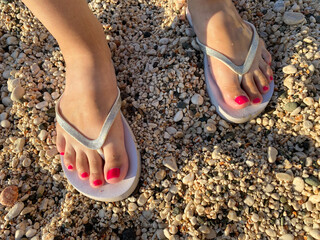 Selfie Shoes Isolated on Top View. Red Nails Manicure. Woman Wearing Gold Slippers (Flip-Flop