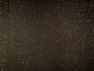 Black shiny texture, sequins with blur background