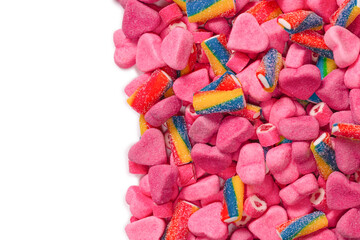 Assorted tasty gummy candies. Pink jelly sweets background.