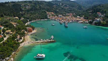Fototapeta na wymiar Aerial drone photo of paradise bay and village of Laka visited by yachts and sail boats, island of Paxos, Ionian, Greece