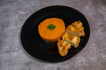 Chicken supreme recipe, gently cooked with 5 spices, sweet potato mousseline, peppers cut in half