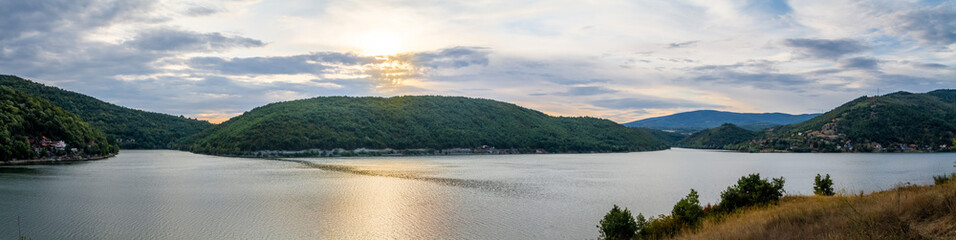 Beautiful lake in East Serbia with clouds and sunset. Sunset at the lake.
