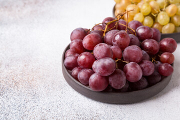 Grapes on a light background. Fresh fruit. Dieting and healthy eating. Copy space