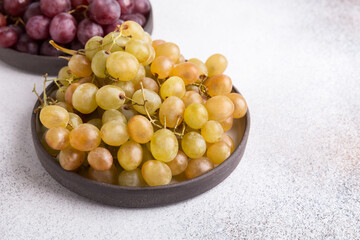 Grapes on a light background. Fresh fruit. Dieting and healthy eating. Copy space