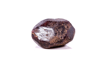 Macro of a mineral garnet stone on a white background