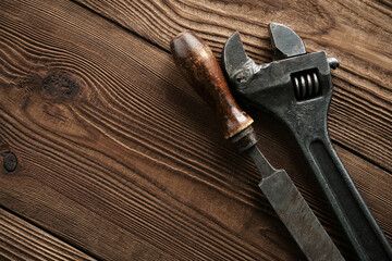 Set of tools over a wood panel. Collection of vintage tools.