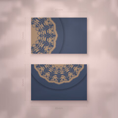 Presentable blue business card with brown mandala pattern for your brand.