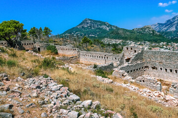 Fototapeta na wymiar Ruins of an ancient fortress on a mountain in the vicinity of the city of Sutomore (Montenegro). Golo brdo. Mountains. Balkans.