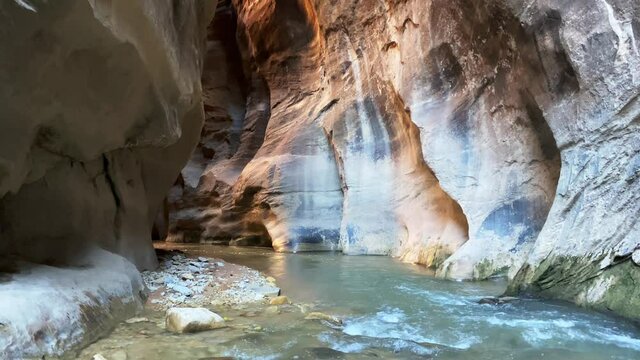 Water stream in narrow slot canyon in Utah