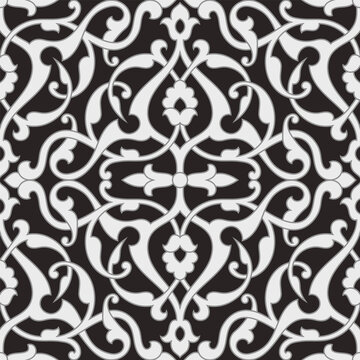 Abstract floral seamless pattern in Arabic style. Intersecting elegant stylized leaves and scrolls forming abstract monochrome floral ornament. Arabesque design for textile, fabric and wallpaper.