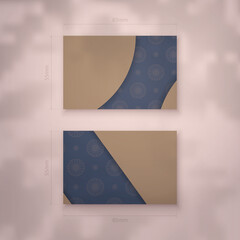 Presentable business card in blue with Greek brown ornaments for your contacts.