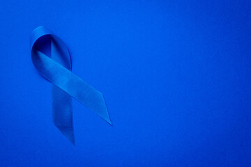 Ribbon cancer. Awareness of men health in November with blue prostate cancer ribbon isolated on...