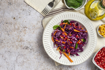 Homemade Purple Cabbage Salad with Corn, Carrots, Pomegranate and Spinach