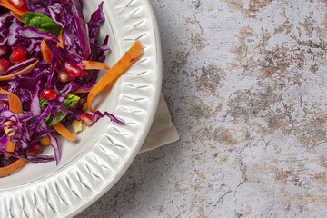 Homemade Purple Cabbage Salad with Corn, Carrots, Pomegranate and Spinach