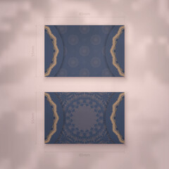 Presentable business card in blue with luxurious brown ornaments for your brand.