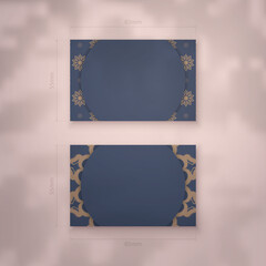 Presentable business card in blue with vintage brown ornaments for your personality.