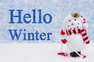 Hello Winter message with a happy snowman skiing and snow