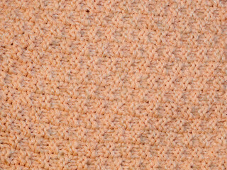 Multicolored ornament knitted from woolen threads. 