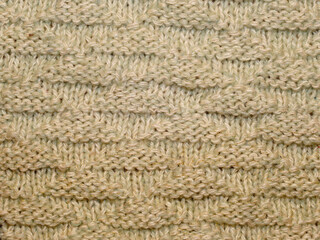 Multicolored ornament knitted from woolen threads. 