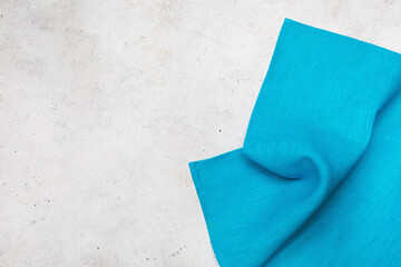 Textile blue napkin on the right side of the table with copy space, food background