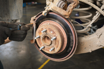 Rusty worn out brake disc of a passenger car