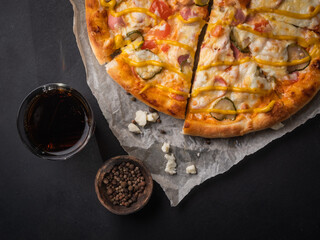 Appetizing pizza, cut into pieces. Italian food, natural ingredients