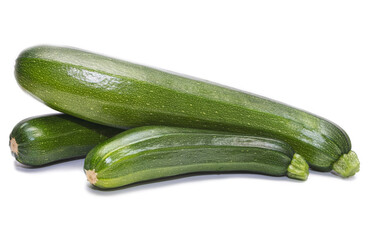 Green zucchini, ripe vegetable on a white background.