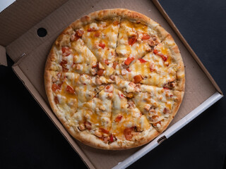 Pizza in a cardboard box