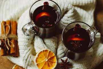 Mulled wine with cinnamon sticks and orange