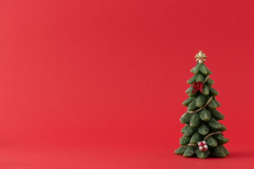 Christmas tree set on a red background.