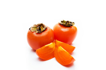 Fresh seasonal persimmon isolated on a white background