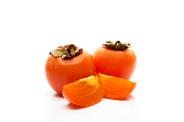 Fresh seasonal persimmon isolated on a white background