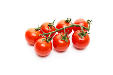 Red cherry tomatoes on a branch isolated on a white background