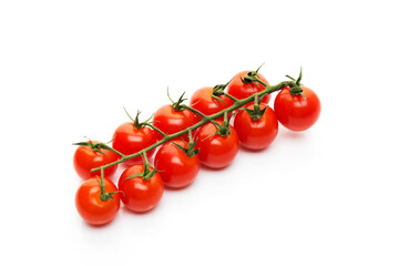 Red cherry tomatoes on a branch isolated on a white background