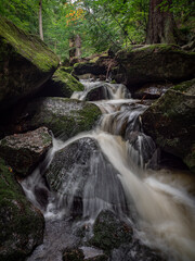 Fototapeta na wymiar Waterfall on river Ilse in forest Harz, Germany