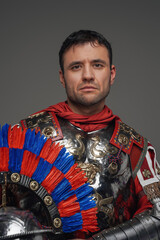 Portrait of ancient roman centurion against gray background