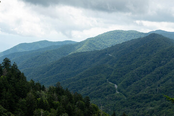 Fototapeta na wymiar The Great Smoky Mountains with clouds above and a road below.