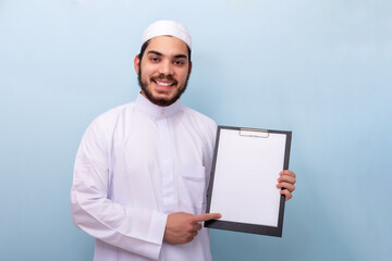 Arabian muslim man with beard and traditional outfit.