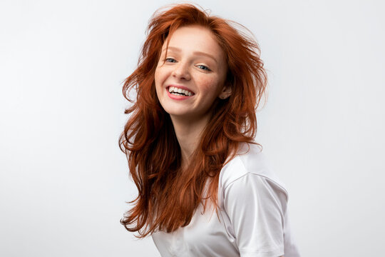 Headshot Of Red-Haired Teen Girl With Loose Hair, White Background