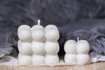 Trendy Soy Wax Cube Bubble Candles on grey soft background, Interior object