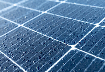 Solar panels on a construction site with raindrops on them