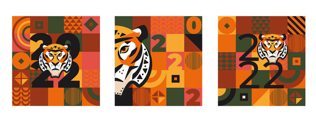 Set 2022 New Year cards with tiger's face,numbers 2022 on geometric background with square,triangular,round shapes.Template design for banners,flyers,invitations, greetings,posters,web,covers.Vector