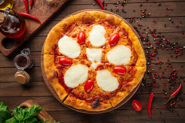Appetizing pizza with mozzarella cheese and tomatoes